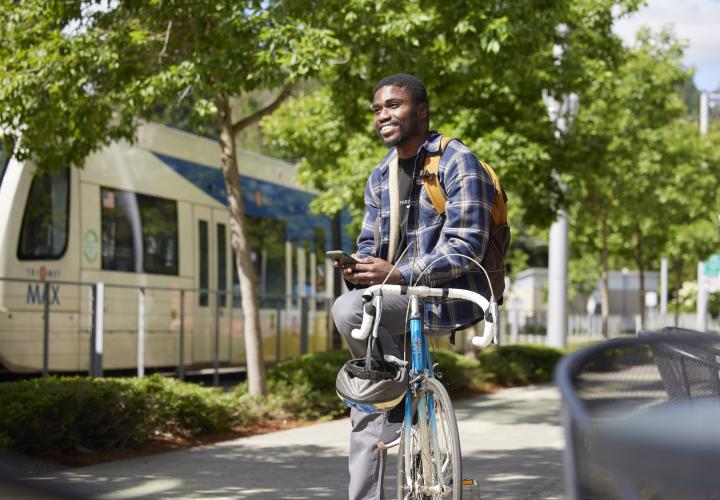 Man on bike next to Max