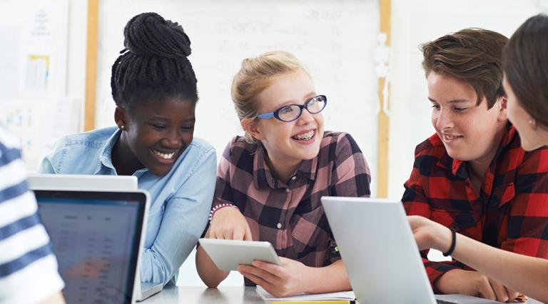 Students doing homework together at a table