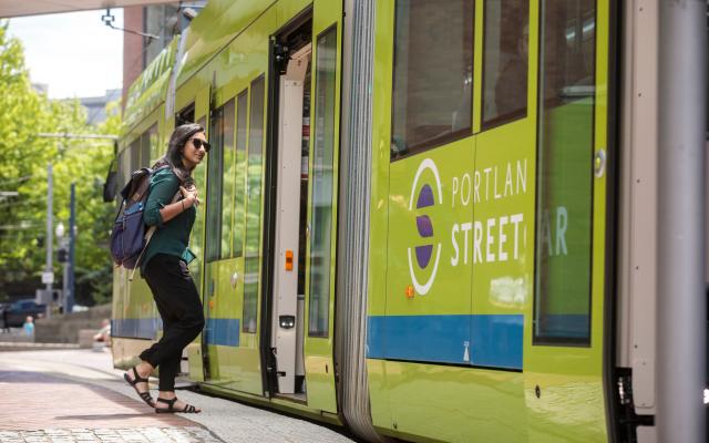 person boarding a streetcar